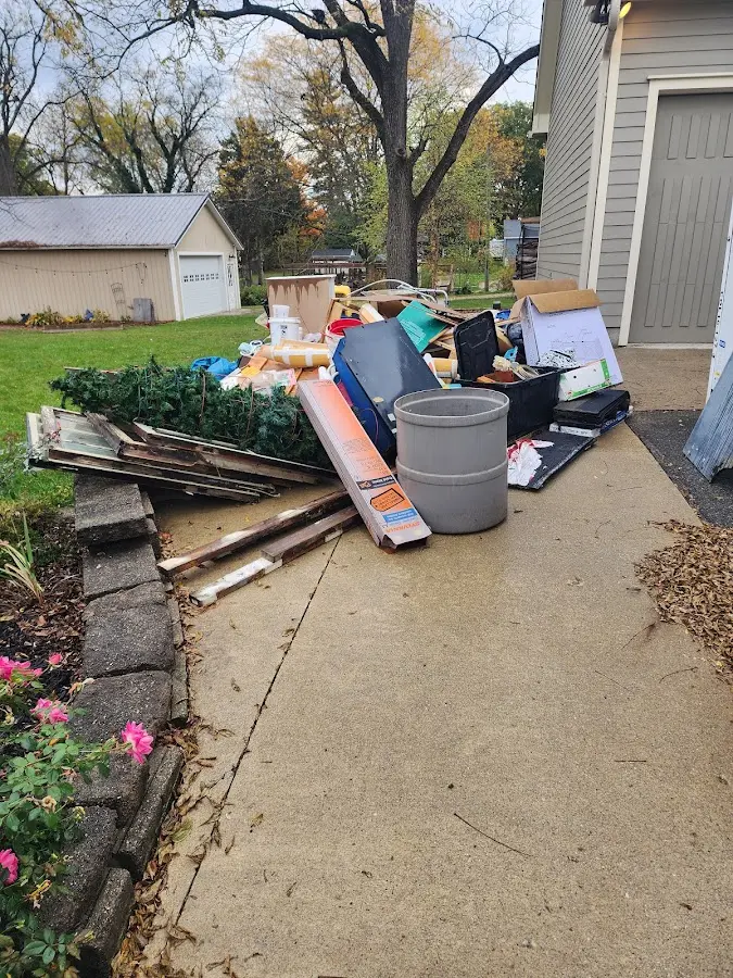 Dumpster being loaded with debris for Commercial Dumpster Rental in Memphis